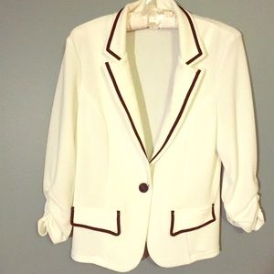 Women’s white short jacket with navy blue piping
